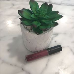 Bareminerals “Devious” matte lip color.